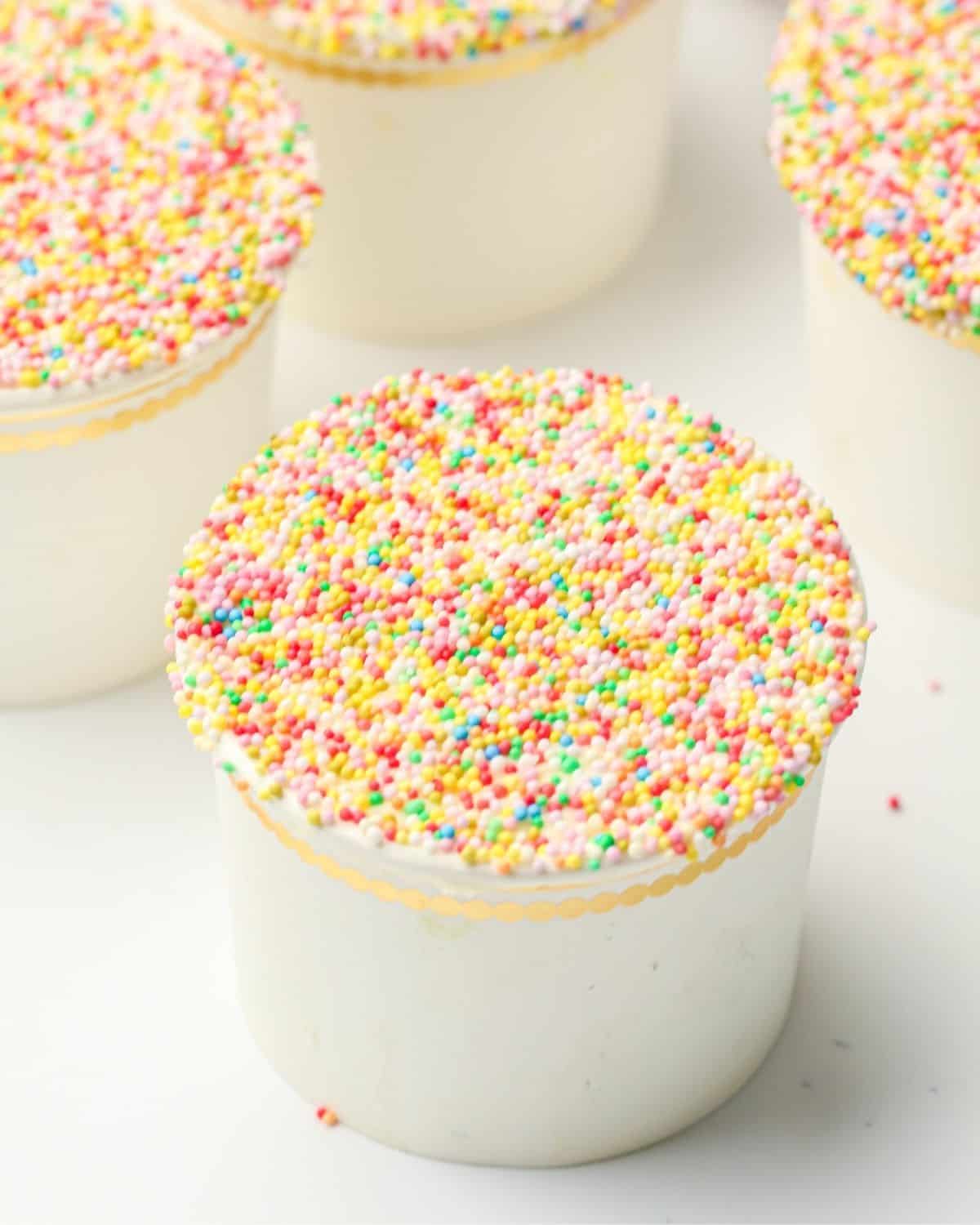 A viral dot cake in a gold-trimmed cup