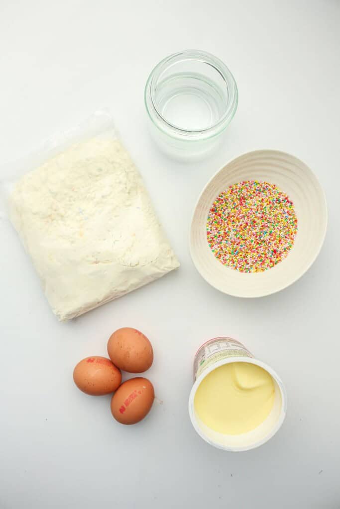 Funfetti cake mix, eggs, water, oil, and rainbow nonpareils for viral dot cakes
