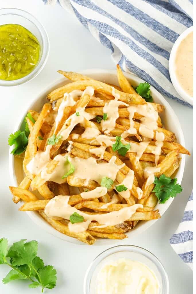 Copycat In-N-Out Animal Sauce drizzled over crispy french fries