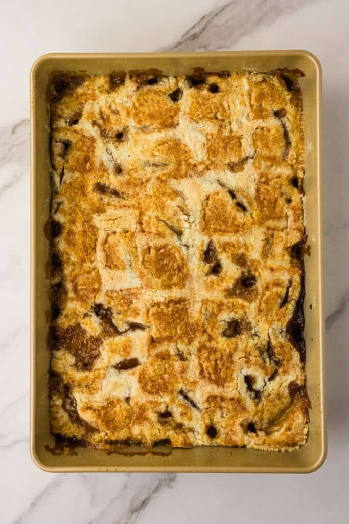 baked peach dump cake with golden brown buttery topping