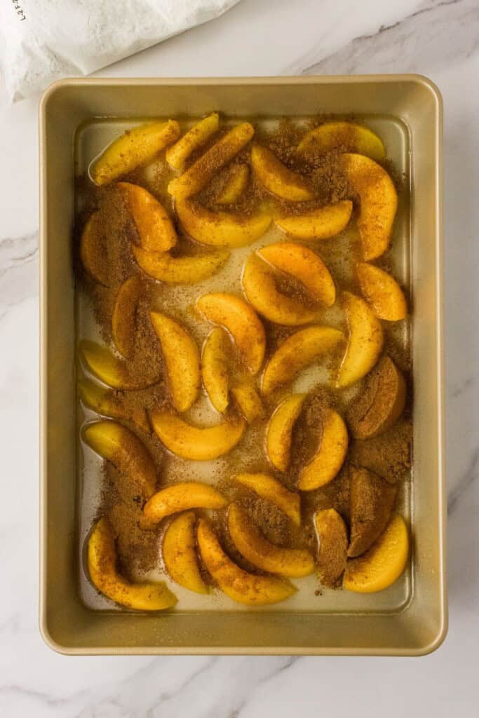 ground cinnamon sprinkled over canned peaches for dump cake