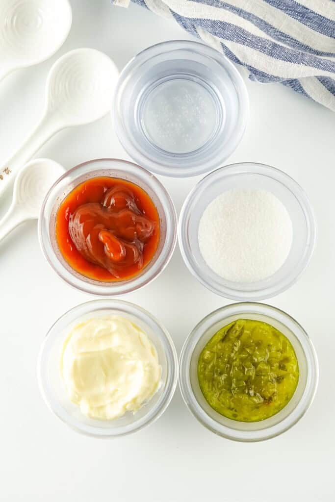Mayo, ketchup, sweet pickle relish, vinegar and sugar measured in prep bowls