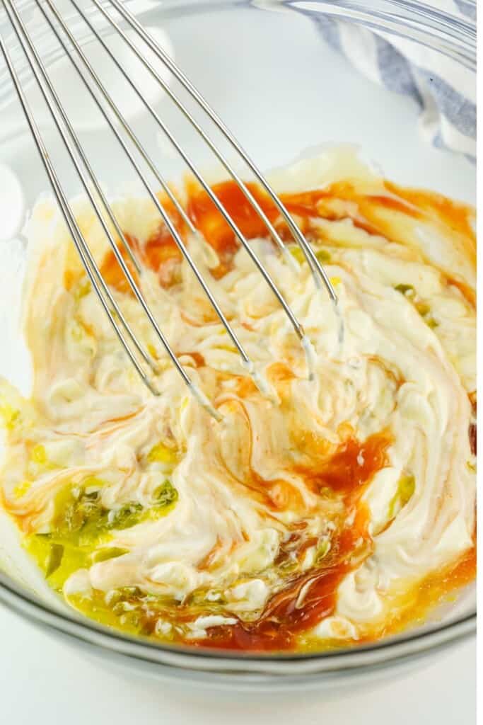 Whisking mayo, ketchup and relish together to make Animal Sauce
