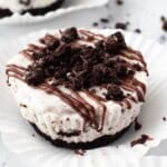 No bake mini Oreo cheesecake with chocolate ganache in a cupcake liner
