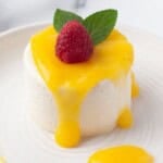 Panna Cotta with mango sauce on a white plate