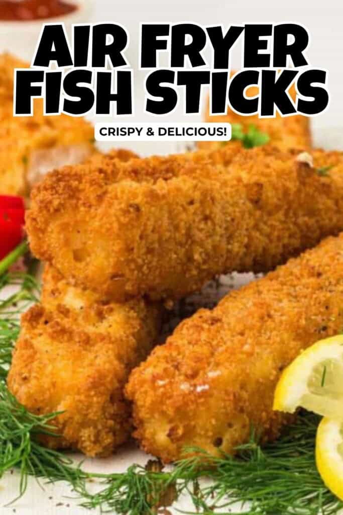 Air fryer fish sticks on a bed of fresh dill with lemon slices